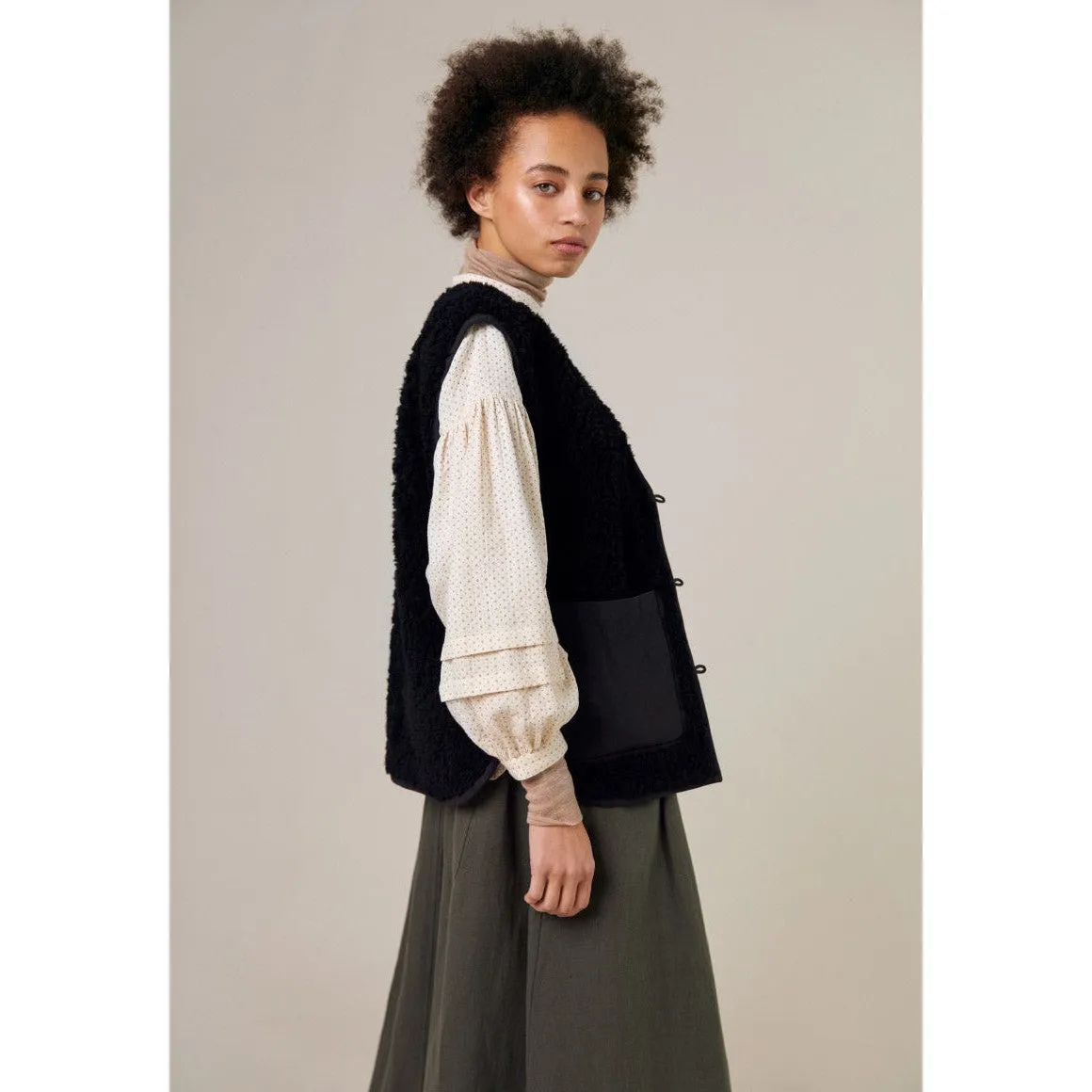 Sideline - Spin reversible vest - black shearling