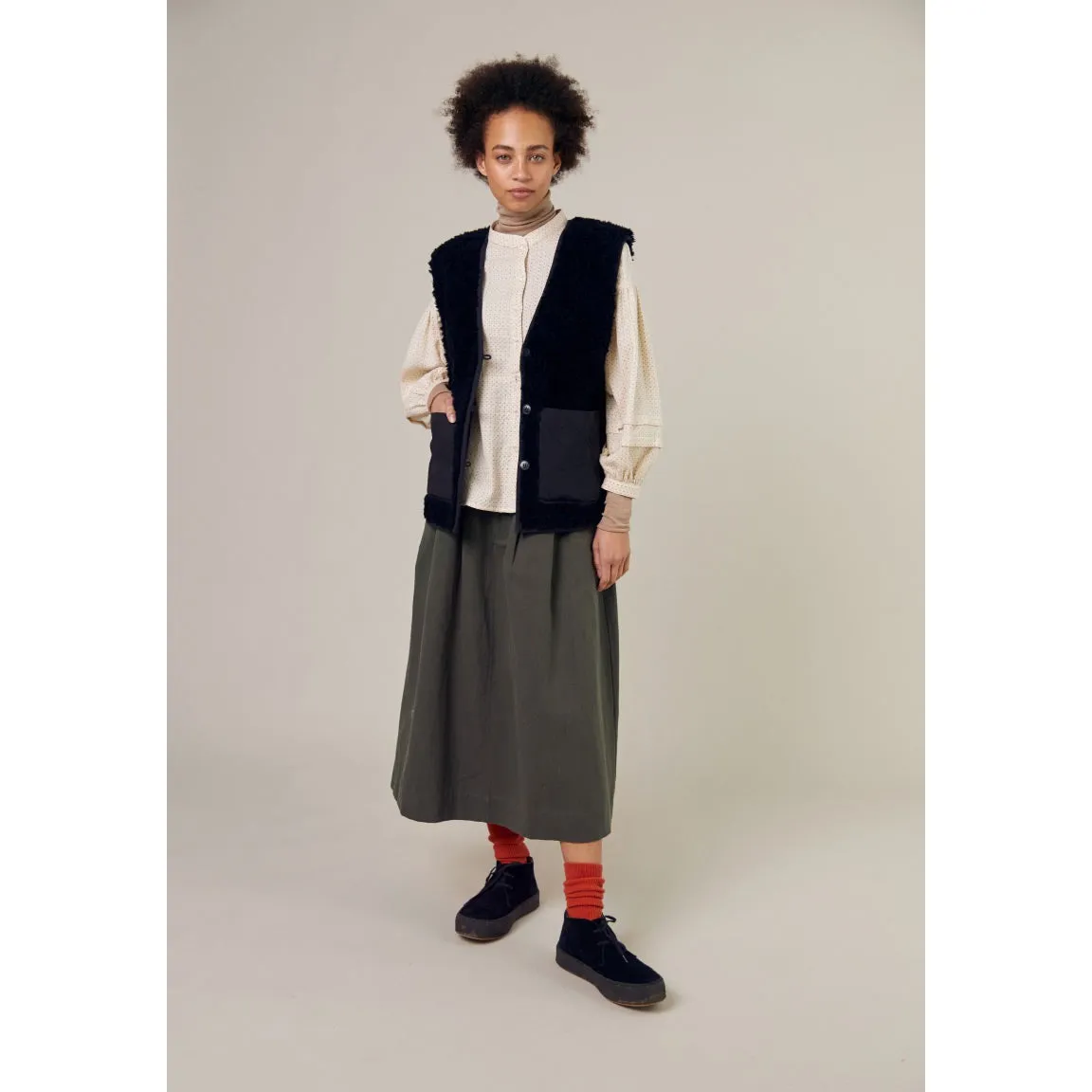 Sideline - Spin reversible vest - black shearling